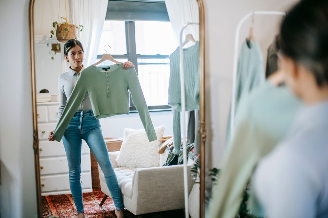 Woman selecting the perfect smart outfit from a curated AI-planned capsule wardrobe